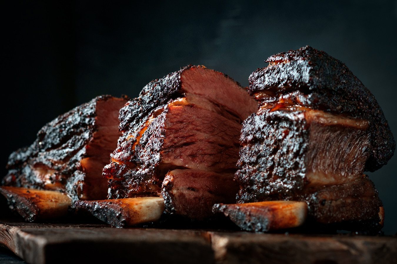 Wood cutting board with Smoked beef ribs Classic Texas BBQ