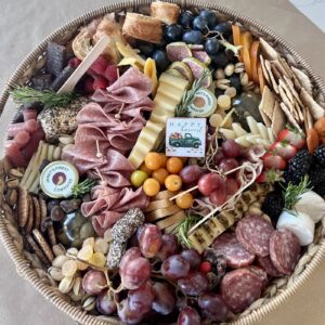 A vibrant charcuterie board brimming with premium meats cheeses fresh fruits nuts and crackersdesigned to impress and satisfy every guest From Fork and Flare Charcuterie