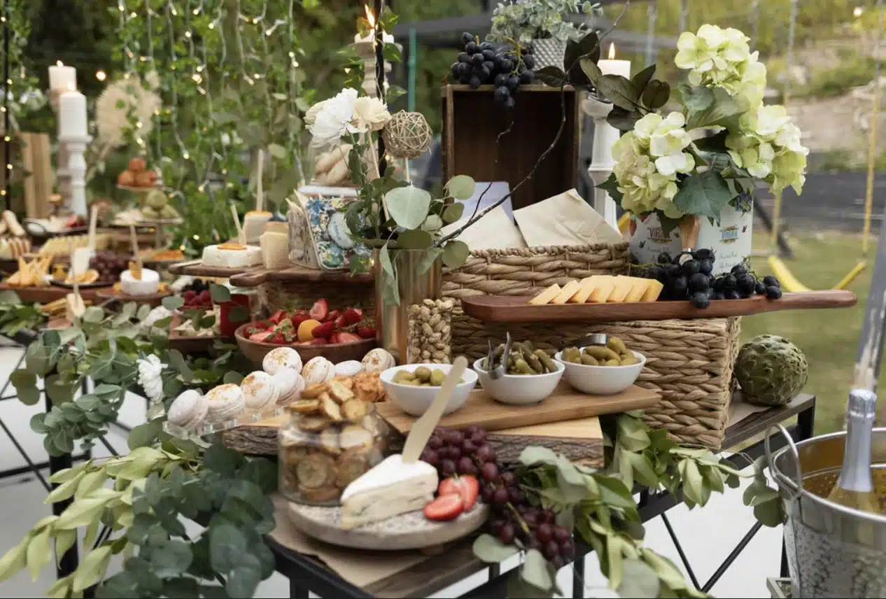 A beautifully styled charcuterie grazing table in Orange County featuring an elegant selection of artisan cheeses cured meats fresh fruits gourmet spreads nuts and crackers perfect for weddings corporate events and special gatherings in Irvine Newport Beach Costa Mesa and surrounding areas Expertly curated for a stunning and delicious display