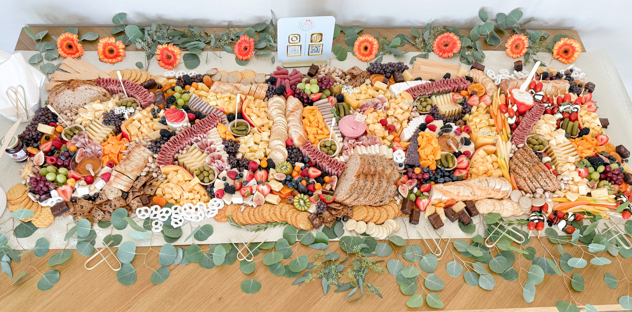 Fork and Flare charcuterie grazing table in Orange County with cheeses meats fruits and crudités for weddings parties and events